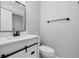 Bright bathroom featuring modern fixtures, a white vanity with black hardware, and a shower-tub combination at 3537 Lighthouse Way, Myrtle Beach, SC 29577