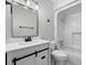 Bright bathroom featuring modern fixtures, a white vanity with black hardware, and a shower-tub combination at 3537 Lighthouse Way, Myrtle Beach, SC 29577
