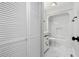 Bright bathroom featuring modern fixtures, a white vanity with black hardware, and a shower-tub combination at 3537 Lighthouse Way, Myrtle Beach, SC 29577