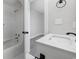 Clean bathroom showcasing a modern vanity, updated fixtures, white tiling, and a shower-tub combination at 3537 Lighthouse Way, Myrtle Beach, SC 29577
