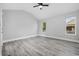 Bedroom featuring vaulted ceiling, ceiling fan, neutral walls, and two windows at 3537 Lighthouse Way, Myrtle Beach, SC 29577