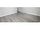 Bedroom with light gray walls and grey wood floors at 3537 Lighthouse Way, Myrtle Beach, SC 29577