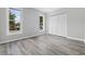 Bedroom featuring natural light from two large windows and a closet with louvered doors at 3537 Lighthouse Way, Myrtle Beach, SC 29577