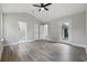 Bedroom with neutral walls, vaulted ceilings, ceiling fan, and ensuite bath with white fixtures at 3537 Lighthouse Way, Myrtle Beach, SC 29577