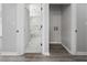 Hallway leading to a bathroom with shower-tub combination and laundry area at 3537 Lighthouse Way, Myrtle Beach, SC 29577