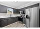 Updated kitchen showcasing stainless steel appliances, dark cabinetry, and ample counter space at 3537 Lighthouse Way, Myrtle Beach, SC 29577