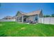Expansive, lush backyard featuring a patio area with outdoor seating and a grill, perfect for entertaining guests at 365 Lenox Dr., Conway, SC 29526