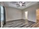 This bedroom features a tray ceiling, ceiling fan, and hard wood flooring at 365 Lenox Dr., Conway, SC 29526