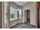 Sunlit breakfast nook with modern wood flooring and large windows offering serene views of the outdoors at 365 Lenox Dr., Conway, SC 29526