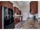 Stylish kitchen with stainless steel appliances, dark wood cabinets, and spacious countertops, perfect for cooking and entertaining at 365 Lenox Dr., Conway, SC 29526