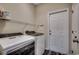 This functional laundry room features a washer, dryer and access door at 365 Lenox Dr., Conway, SC 29526