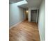Bright bedroom featuring wood-look floors and a closet for storage at 403 71St Ave. N # 14, Myrtle Beach, SC 29575