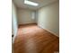 Bright bedroom featuring wood-look floors and ample natural light at 403 71St Ave. N # 14, Myrtle Beach, SC 29575