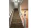 Carpeted staircase with white railings at 403 71St Ave. N # 14, Myrtle Beach, SC 29575