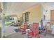 Back porch featuring two rocking chairs and a bench, perfect for relaxing at 424 Villa Woods Dr., Myrtle Beach, SC 29579