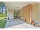 Spacious covered back porch with brick column, offering a cozy outdoor space at 424 Villa Woods Dr., Myrtle Beach, SC 29579