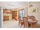 Eat-in kitchen includes tile floors, wood cabinets, and sliding doors for lots of light at 424 Villa Woods Dr., Myrtle Beach, SC 29579