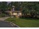 Inviting single-story home with a brick accent, covered carport, and a neatly landscaped front lawn at 424 Villa Woods Dr., Myrtle Beach, SC 29579