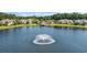 Picturesque aerial view of homes surrounding a lake with fountain at 431 Huntington Lake Circle # 80, Pawleys Island, SC 29585