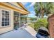 Beautiful backyard featuring a screened porch, a patio area, and lush landscaping overlooking a lake at 431 Huntington Lake Circle # 80, Pawleys Island, SC 29585