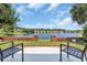 Inviting backyard seating area showcasing a serene lake view and community homes at 431 Huntington Lake Circle # 80, Pawleys Island, SC 29585