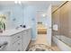 Bathroom features a white vanity, a tub, and is connected to the Primary bedroom at 431 Huntington Lake Circle # 80, Pawleys Island, SC 29585