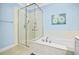 Bathroom features a separate glass shower, a soaking tub, and tile flooring at 431 Huntington Lake Circle # 80, Pawleys Island, SC 29585