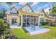 Rear exterior view of home featuring a screened in porch and lovely landscaping at 431 Huntington Lake Circle # 80, Pawleys Island, SC 29585