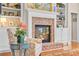 Living room fireplace with brick surround and decorative mantle at 431 Huntington Lake Circle # 80, Pawleys Island, SC 29585