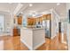 Bright and airy kitchen featuring wooden cabinets, granite countertops, stainless steel appliances, and a center island at 431 Huntington Lake Circle # 80, Pawleys Island, SC 29585