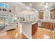 Open-concept kitchen featuring wooden cabinetry, granite countertops, a central island, and stainless steel appliances at 431 Huntington Lake Circle # 80, Pawleys Island, SC 29585