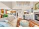 Living room featuring a brick fireplace and open concept to the kitchen at 431 Huntington Lake Circle # 80, Pawleys Island, SC 29585