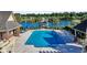 Sparkling community pool with ample lounge chairs and a gazebo overlooking the lake at 431 Huntington Lake Circle # 80, Pawleys Island, SC 29585