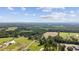 Scenic aerial view of expansive green fields, lush trees, and roads, showcasing the property's landscape at 4446 Boggy Rd., Conway, SC 29526