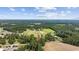 Aerial view of a home nestled among trees, showcasing its location within a vibrant community at 4446 Boggy Rd., Conway, SC 29526