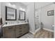 Modern bathroom with double vanity, framed mirrors and a glass enclosed shower at 4446 Boggy Rd., Conway, SC 29526