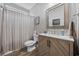Cozy bathroom features a chevron vanity and a shower with striped shower curtain at 4446 Boggy Rd., Conway, SC 29526