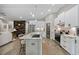 Modern kitchen with white cabinets, granite countertops, and a center island with bar seating at 4446 Boggy Rd., Conway, SC 29526