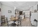 Modern kitchen and dining area with stainless steel appliances and wood accent wall at 4446 Boggy Rd., Conway, SC 29526
