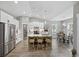 Modern kitchen with white cabinets, stainless steel appliances, and a large island with seating at 4446 Boggy Rd., Conway, SC 29526