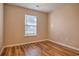 Bedroom with hardwood floors, neutral colored walls and a window at 4524 E Walkerton Rd., Myrtle Beach, SC 29579
