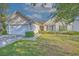 Charming single-story home showcasing a manicured lawn, two-car garage, and inviting front entrance at 4524 E Walkerton Rd., Myrtle Beach, SC 29579