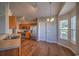 Well-equipped kitchen with stainless steel appliances, wood cabinetry, and a cozy breakfast nook at 4524 E Walkerton Rd., Myrtle Beach, SC 29579