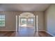 Inviting living area showcasing an arched entryway and lots of natural light through large windows at 4524 E Walkerton Rd., Myrtle Beach, SC 29579