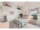 Cozy bedroom with neutral walls, a window with natural light, and a comfortable bed at 4703 Bermuda Way, Myrtle Beach, SC 29577