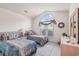 Bedroom featuring twin beds, a large arched window, and coordinated decor at 4703 Bermuda Way, Myrtle Beach, SC 29577