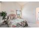 Bright bedroom with a queen bed, a window view, and neutral color scheme at 4703 Bermuda Way, Myrtle Beach, SC 29577