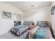 Comfortable bedroom with twin beds, mirrored closet doors, and natural light at 4703 Bermuda Way, Myrtle Beach, SC 29577