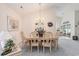 Light and airy dining room features classic chandelier and views of the backyard at 4703 Bermuda Way, Myrtle Beach, SC 29577