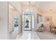 Bright entryway featuring tile flooring, an arched window above the door, and views of the adjacent rooms at 4703 Bermuda Way, Myrtle Beach, SC 29577